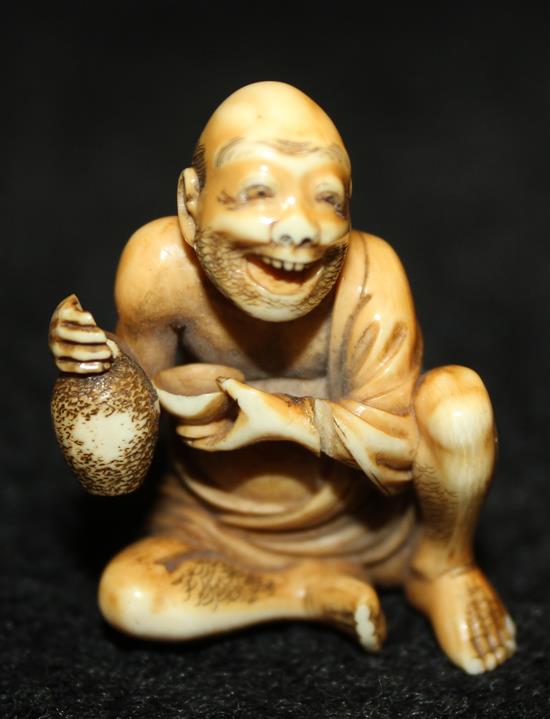Japanese ivory netsuke modelled as a street vendor (a.f)